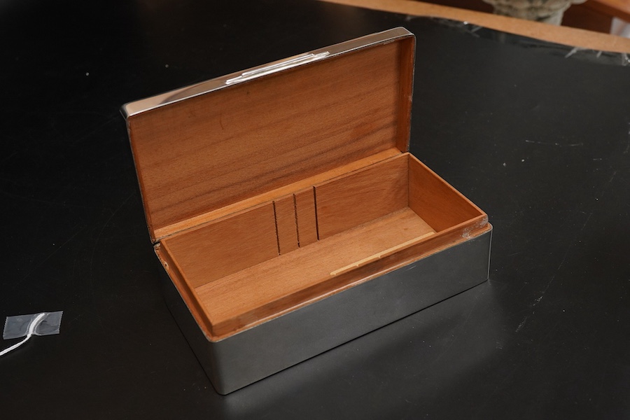 An Elizabeth II silver mounted rectangular cigarette box, with R.A.F. related engraved inscription, Sheffield, 1957, 17.7cm.